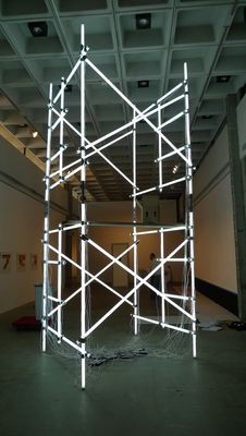 a sculpture made of scaffolding in a large room