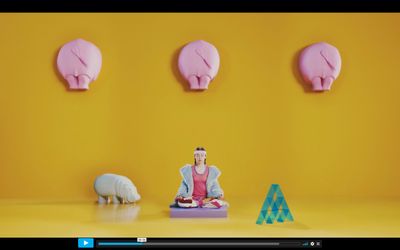 a woman sitting on a yoga mat in front of three pink pig heads