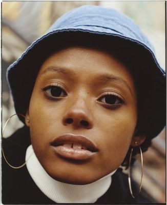 a close up of a person wearing a hat