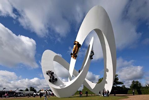 a large white sculpture with a person on a skateboard