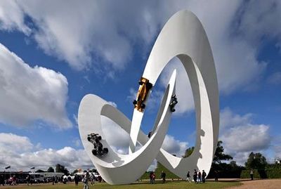 a large white sculpture with a person on a skateboard