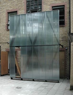 a building with a large metal door on the side of it