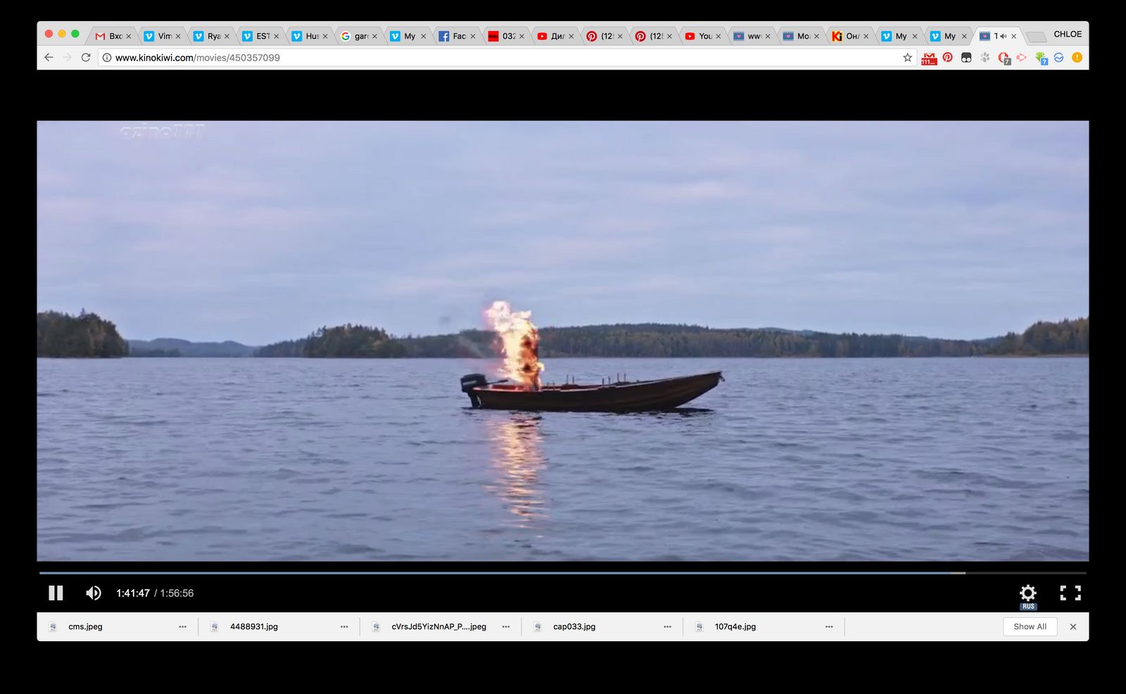 a boat on a lake with a fire in it