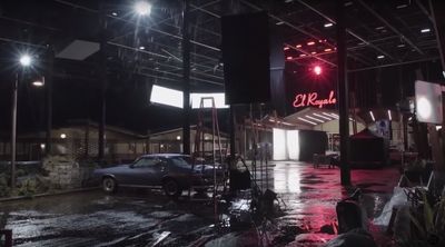 a car is parked in a parking lot at night