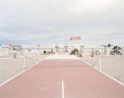 a tennis court with a net in the middle of it