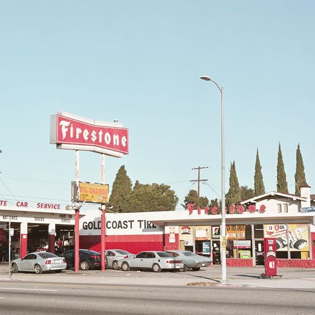 a fire station with cars parked in front of it