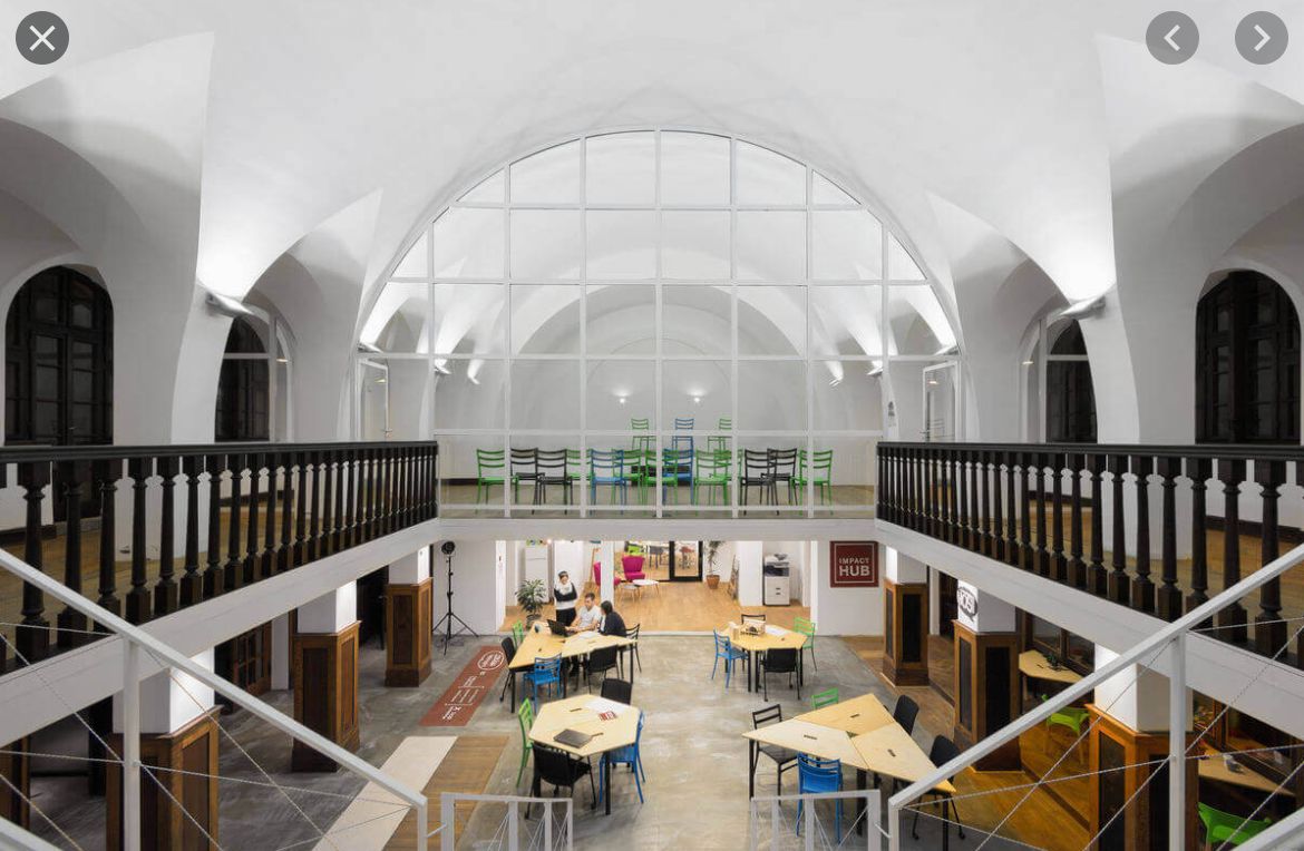 a view of a large room with tables and chairs