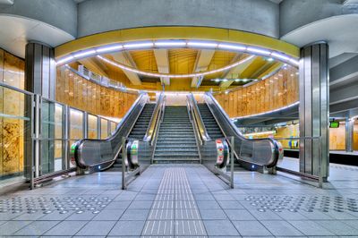 an escalator and stairs in a building