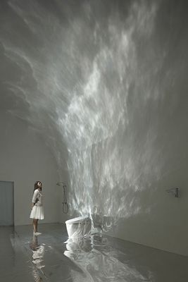 a woman in a white dress standing in front of a toilet