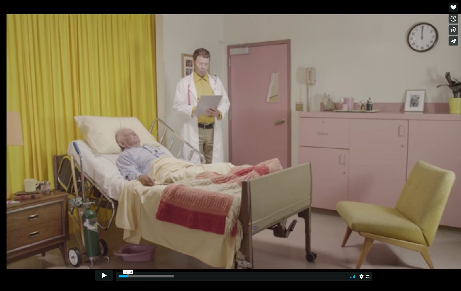 a man laying in a hospital bed next to a woman