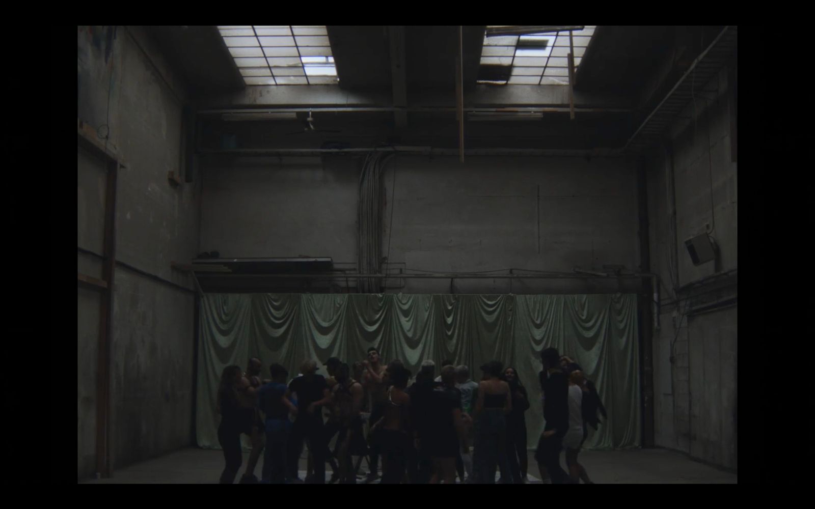 a group of people standing in a large room