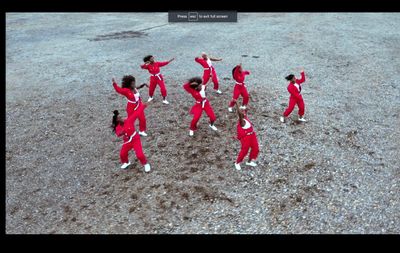 a group of people in red and white outfits