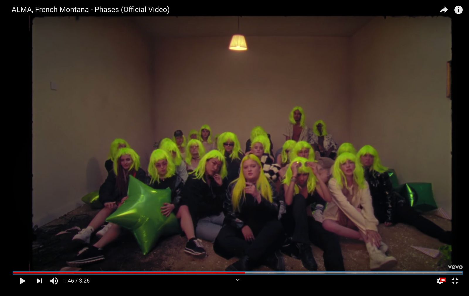 a group of people with green wigs posing for a picture