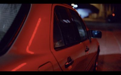 a red car parked on the side of the road