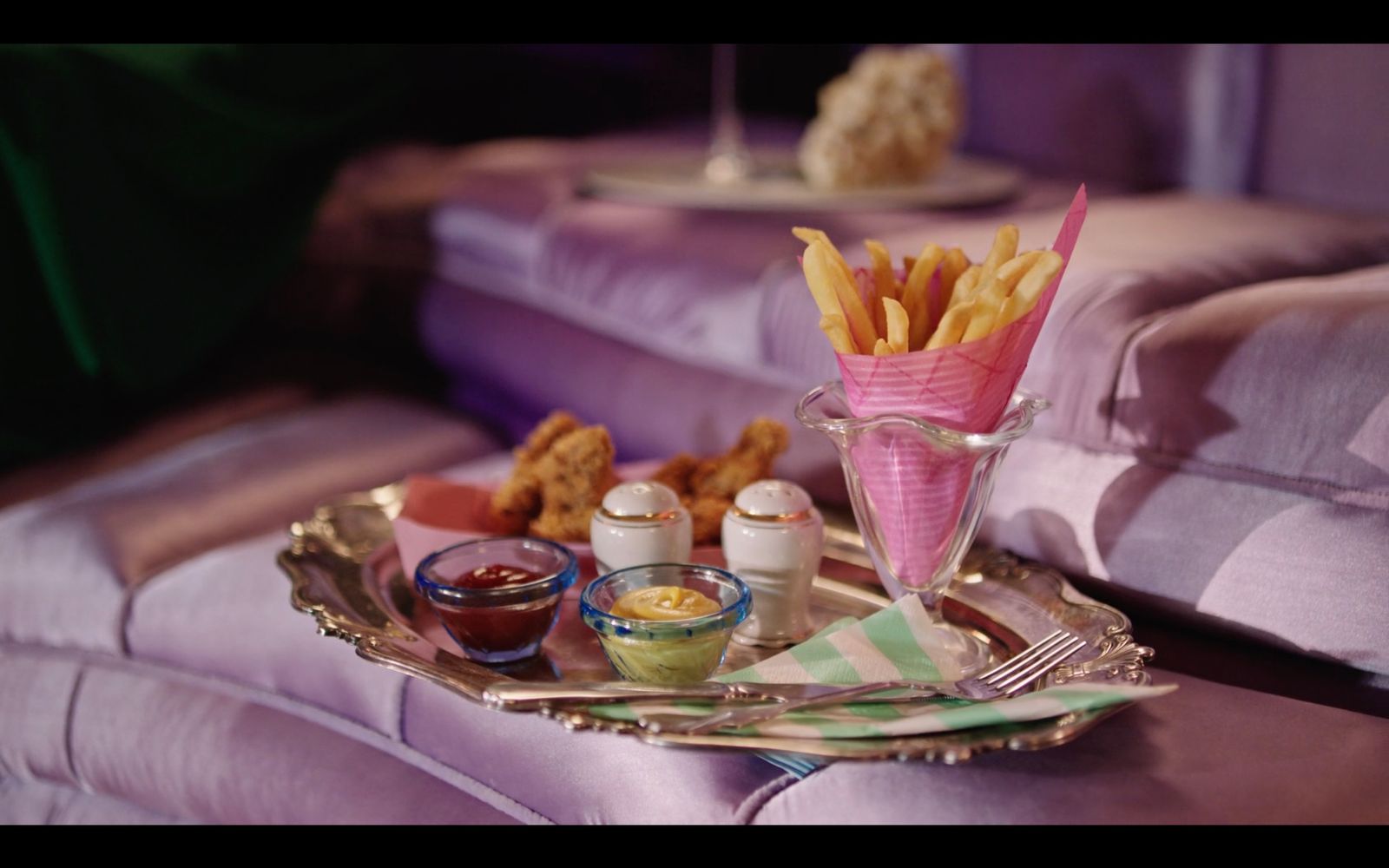 a tray with some fries and dipping sauces on it