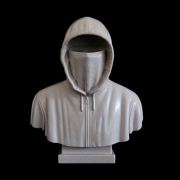 a white statue of a person wearing a hoodie