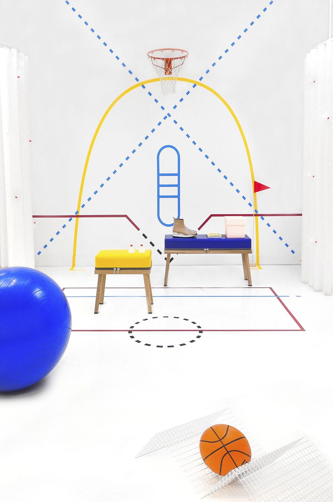 a room with a basketball, a bench, and a chair