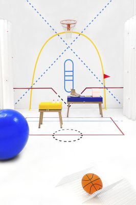 a room with a basketball, a bench, and a chair