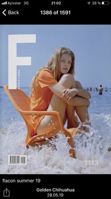 a magazine cover with a woman sitting on a beach chair