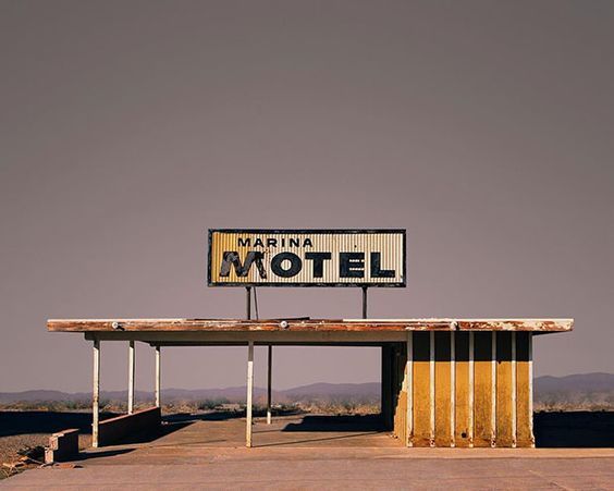 a motel sign sitting on top of a building