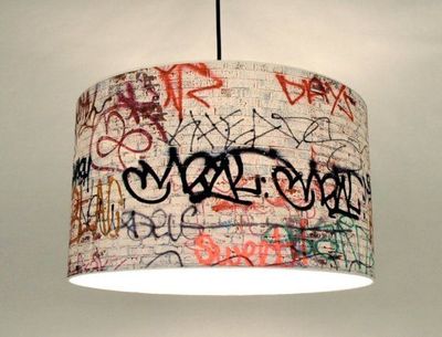 a chandelier with graffiti all over it