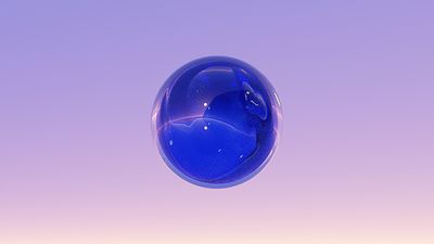 a blue glass ball floating in the air