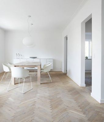 a dining room with a table and chairs