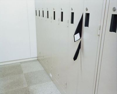 a row of lockers with black and white flags on them