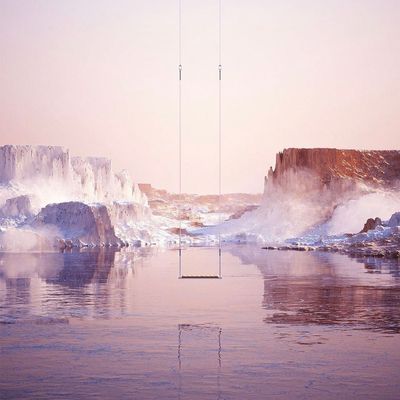 a body of water surrounded by ice covered mountains