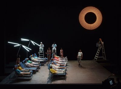 a group of people standing on top of a stage