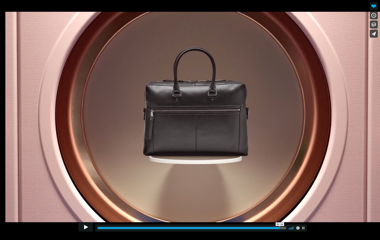 a black briefcase sitting on top of a round object