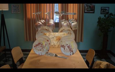 a wooden table topped with lots of dirty dishes