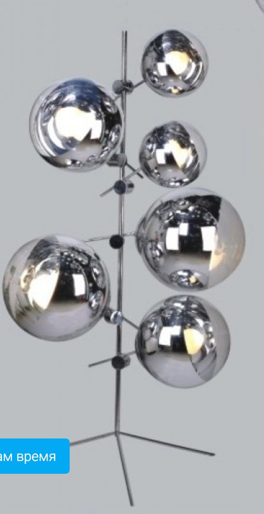 a metal light fixture with five balls on it