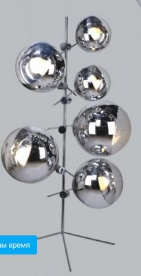 a metal light fixture with five balls on it