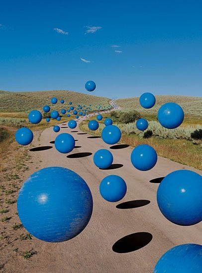 a bunch of blue balls on a road