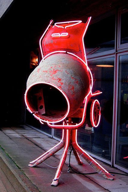 a large metal object with a red light on top of it