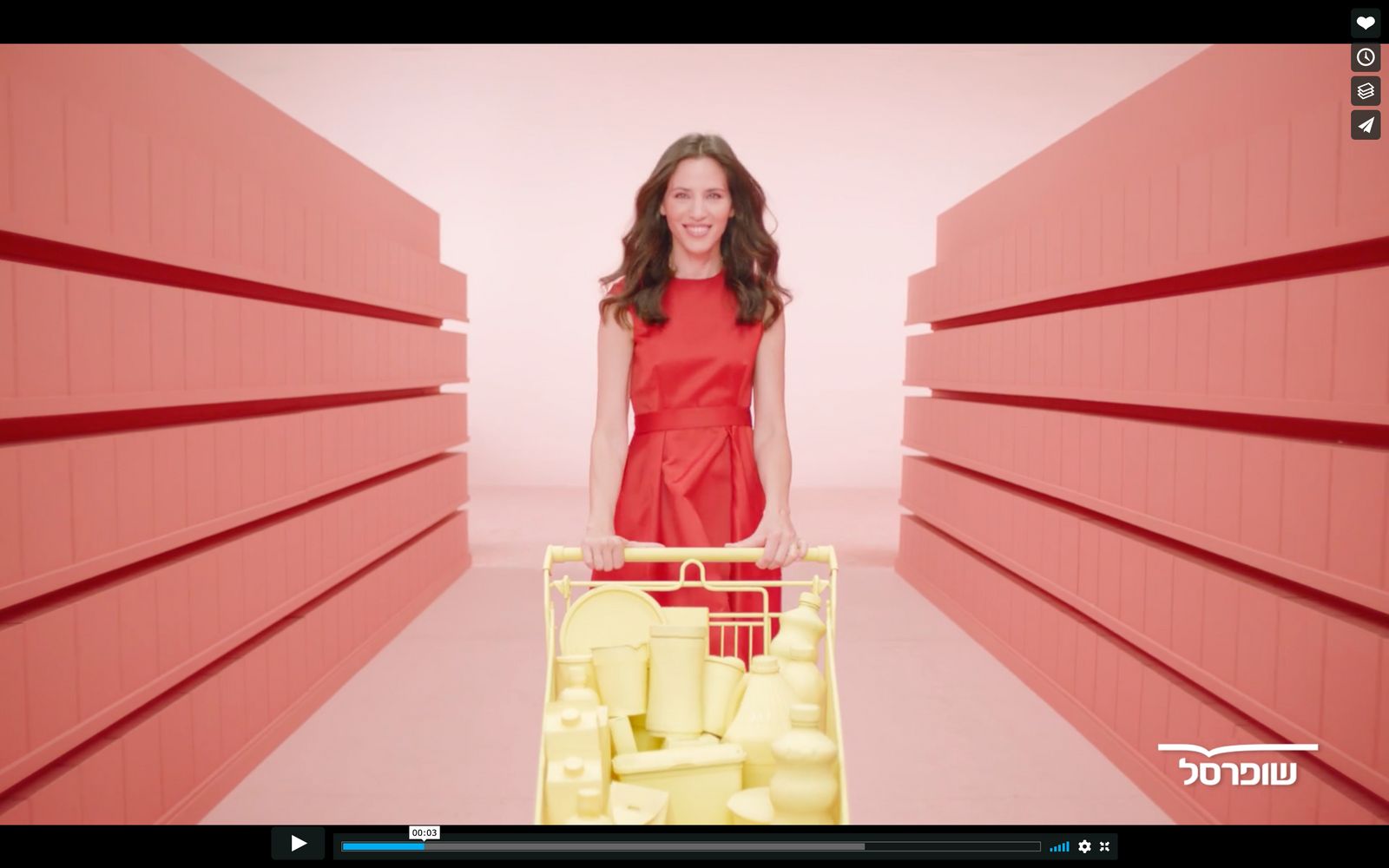 a woman in a red dress holding a shopping cart