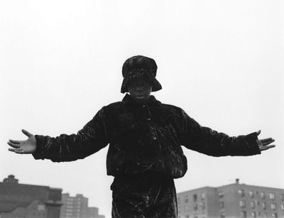 a black and white photo of a person on a skateboard