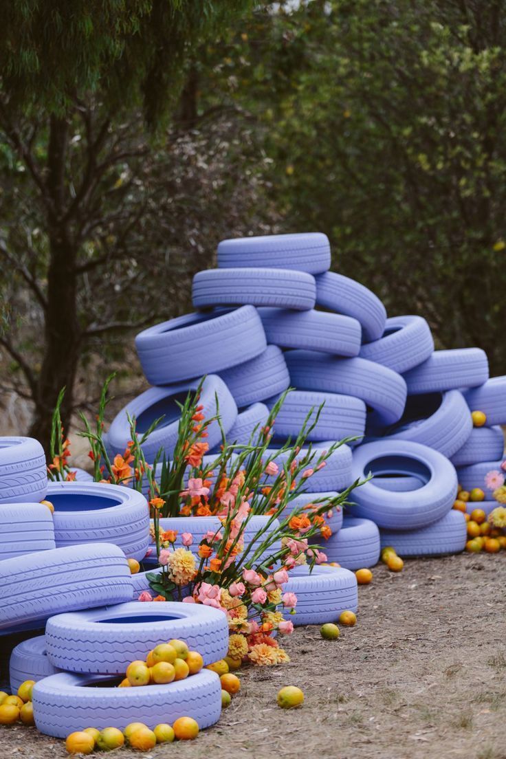 a bunch of blue tires stacked on top of each other