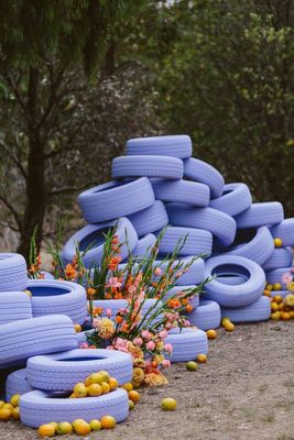 a bunch of blue tires stacked on top of each other