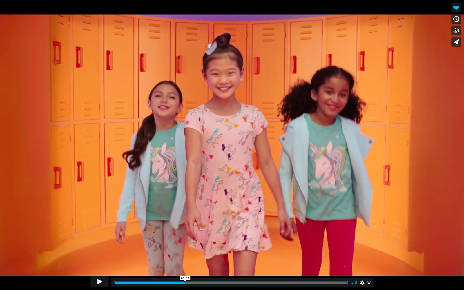 a group of young girls standing next to each other