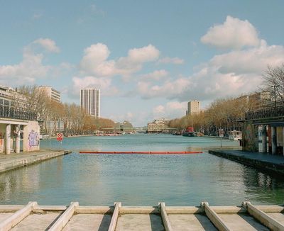 a body of water surrounded by tall buildings