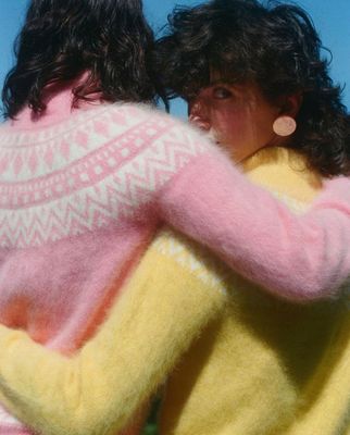 a couple of women standing next to each other