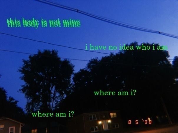 a picture of a street at night with the words, this body is not mine