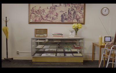 a room with a table and a clock on the wall