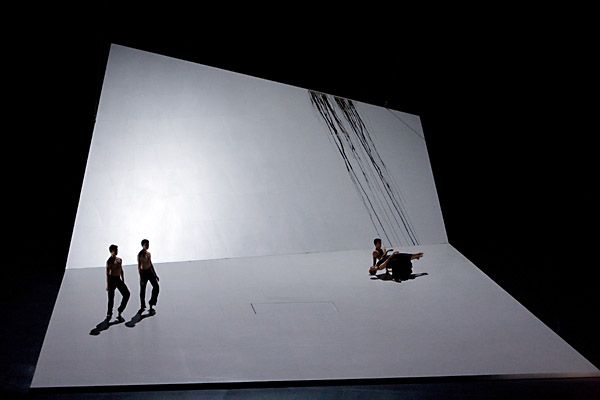 a group of people standing on top of a stage