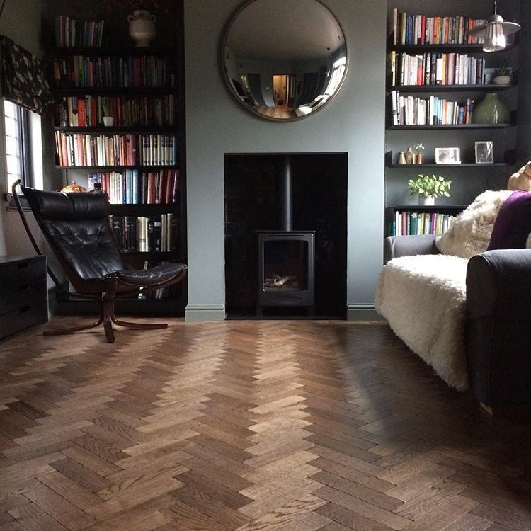 a living room filled with furniture and a fire place