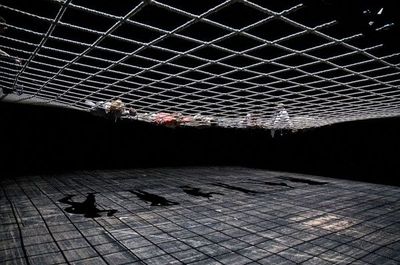 a large room with a metal grid ceiling