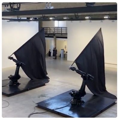 a couple of black sculptures sitting on top of a floor