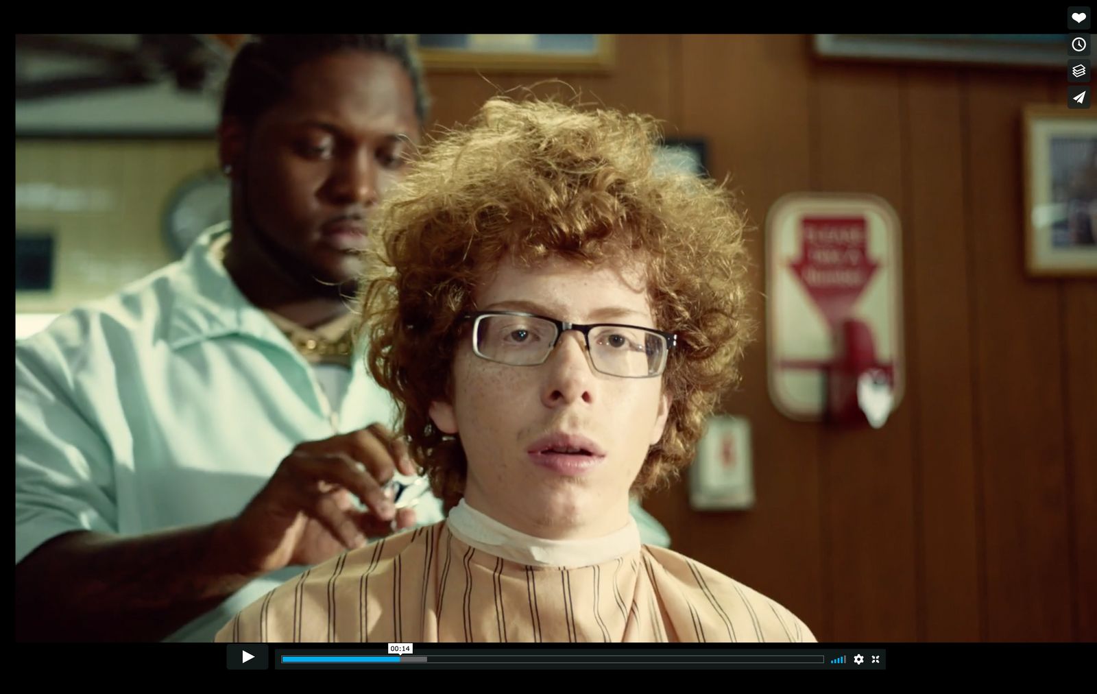 a woman getting her hair cut by a man